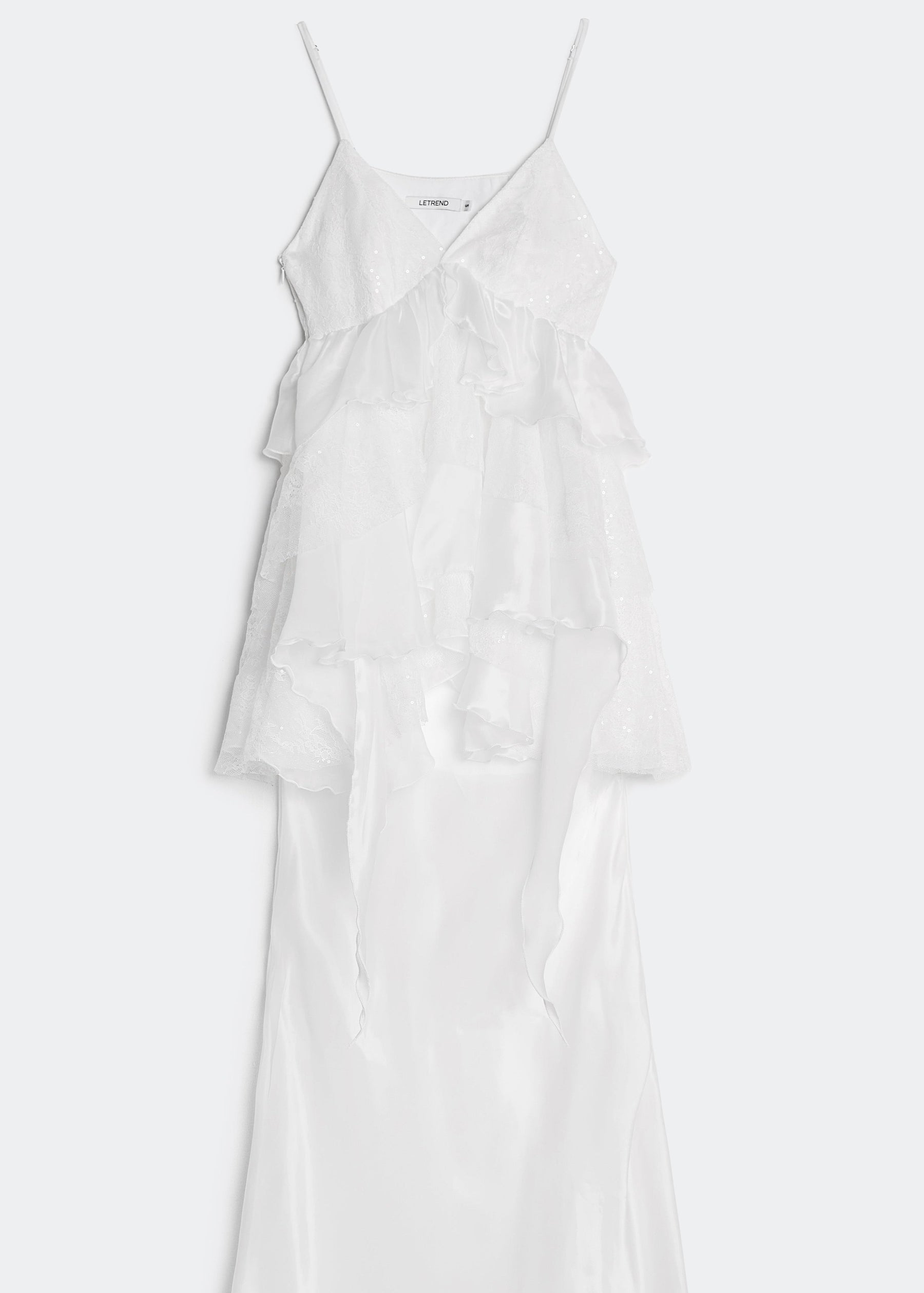 White dress with thin straps on a white background