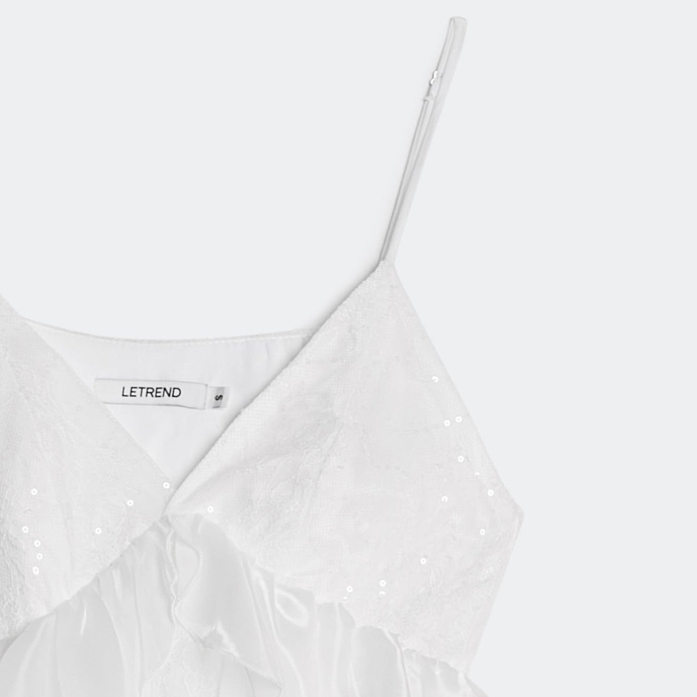 White dress with thin straps on a white background, featuring the brand 'LETREND'.